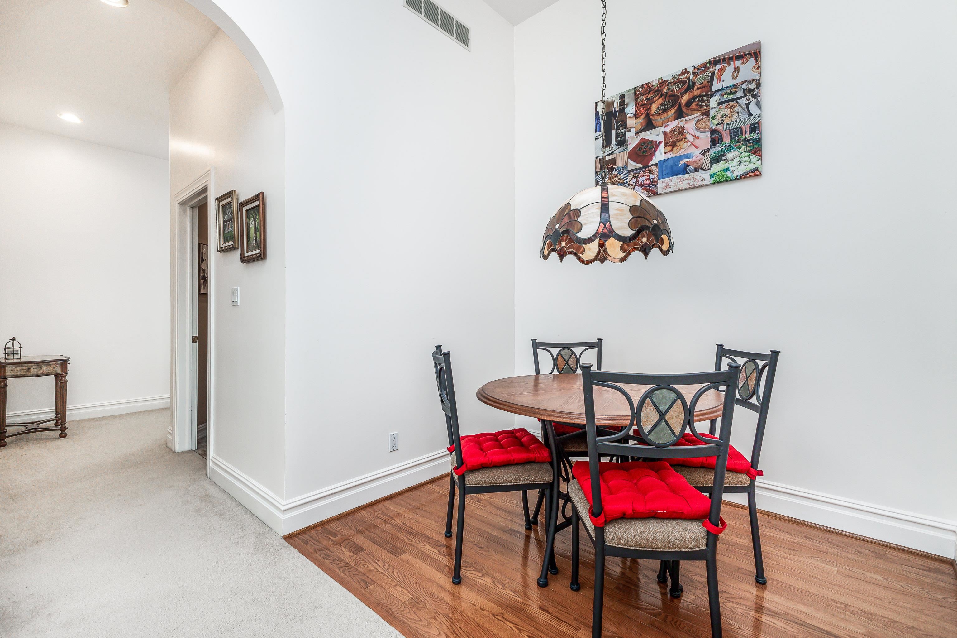 411 South Prospect Street, Unit 204 Galena, IL 61036 - Photo 10 of 18 a view of a dining room with furniture and wooden floor