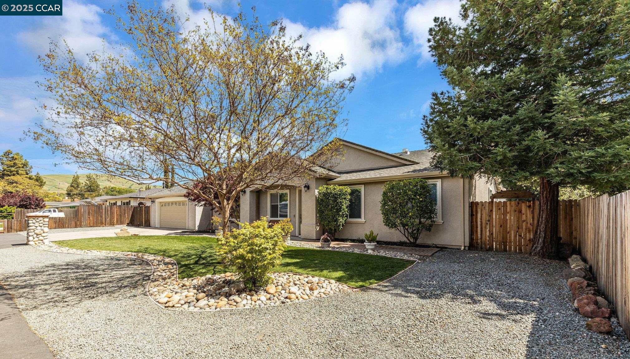 1840 Earl Lane Concord, CA 94521 - Photo 1 of 1 a front view of a house with a yard and potted plants