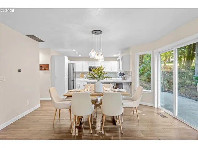 a view of a dining room with furniture window and outside view