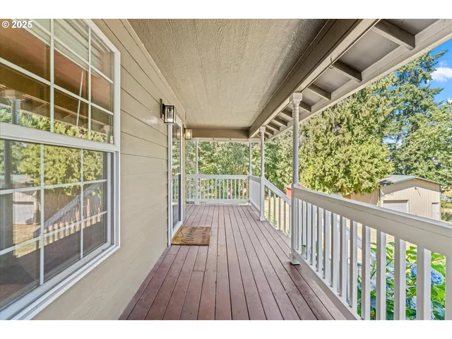 a view of balcony with wooden floor