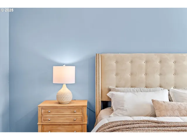 a living room with furniture and a lamp