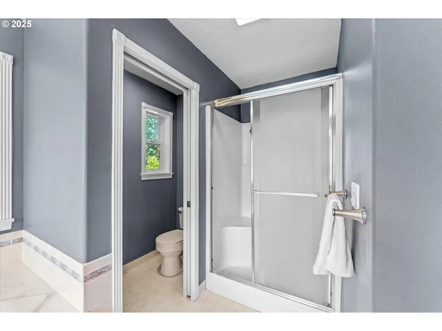 a bathroom with a sink mirror vanity and bathtub