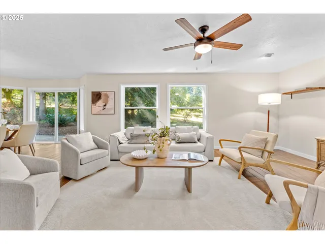 a living room with furniture and windows