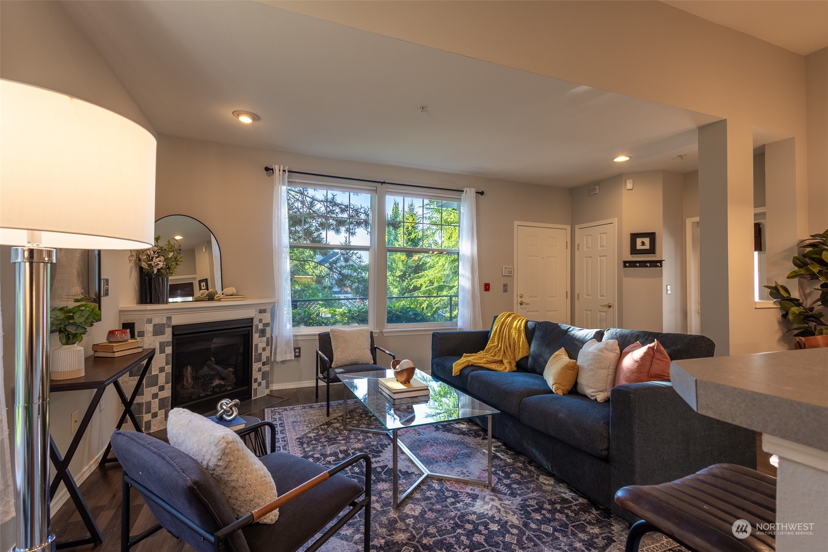16125 Juanita Woodinville Way Northeast, Unit 2201 Bothell, WA 98011 - Photo 18 of 35 a living room with furniture fireplace and a window
