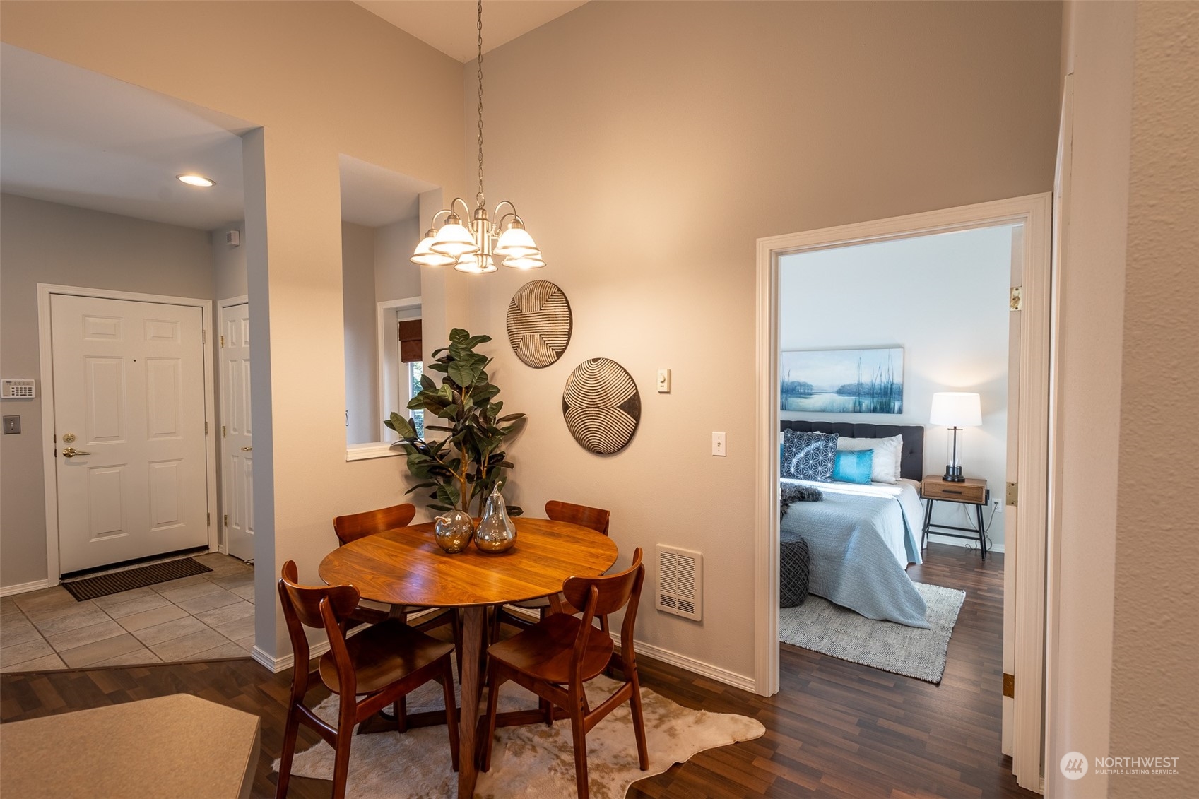 16125 Juanita Woodinville Way Northeast, Unit 2201 Bothell, WA 98011 - Photo 20 of 35 a view of a dining room with furniture and wooden floor