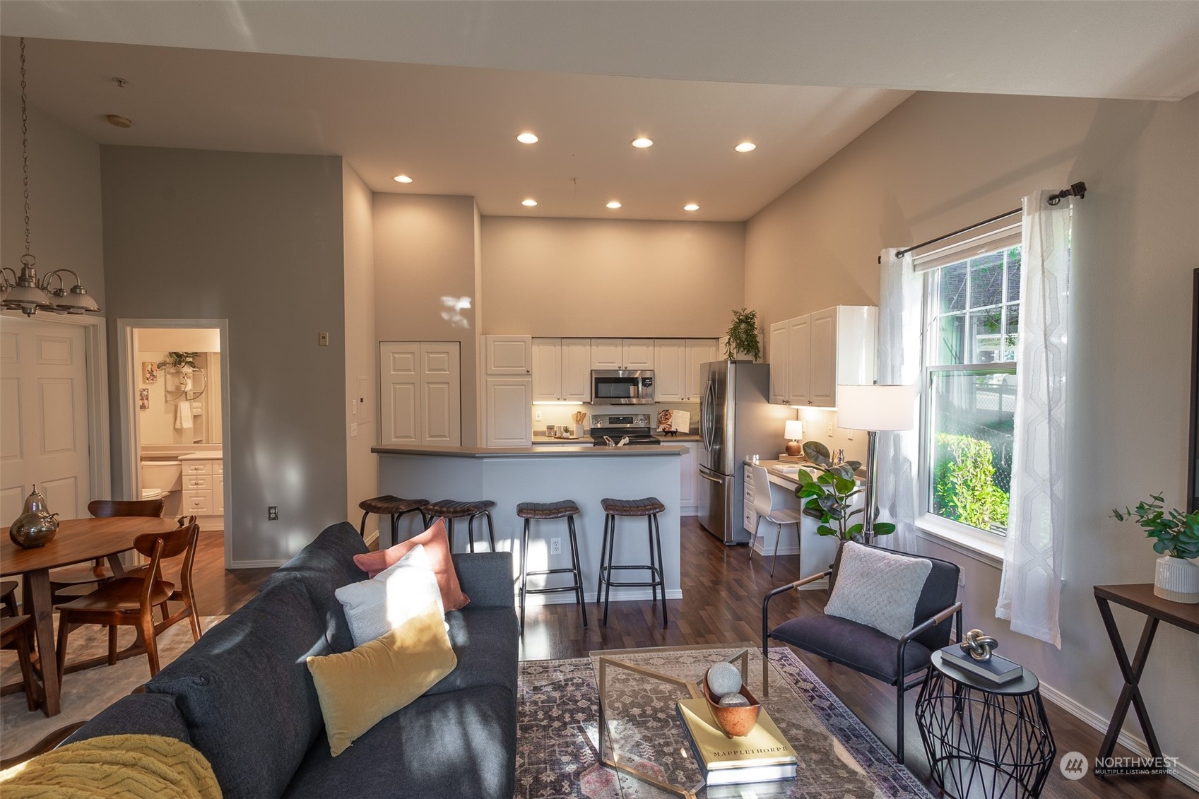 16125 Juanita Woodinville Way Northeast, Unit 2201 Bothell, WA 98011 - Photo 4 of 35 a living room with furniture and a large window