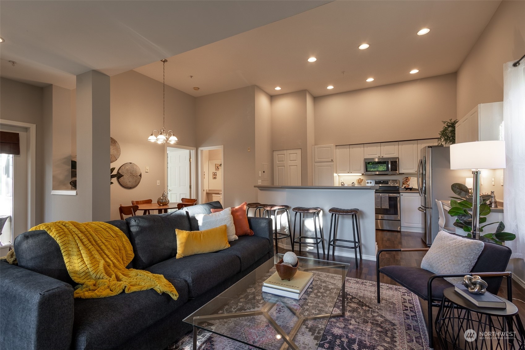 16125 Juanita Woodinville Way Northeast, Unit 2201 Bothell, WA 98011 - Photo 5 of 35 a living room with furniture and a wooden floor