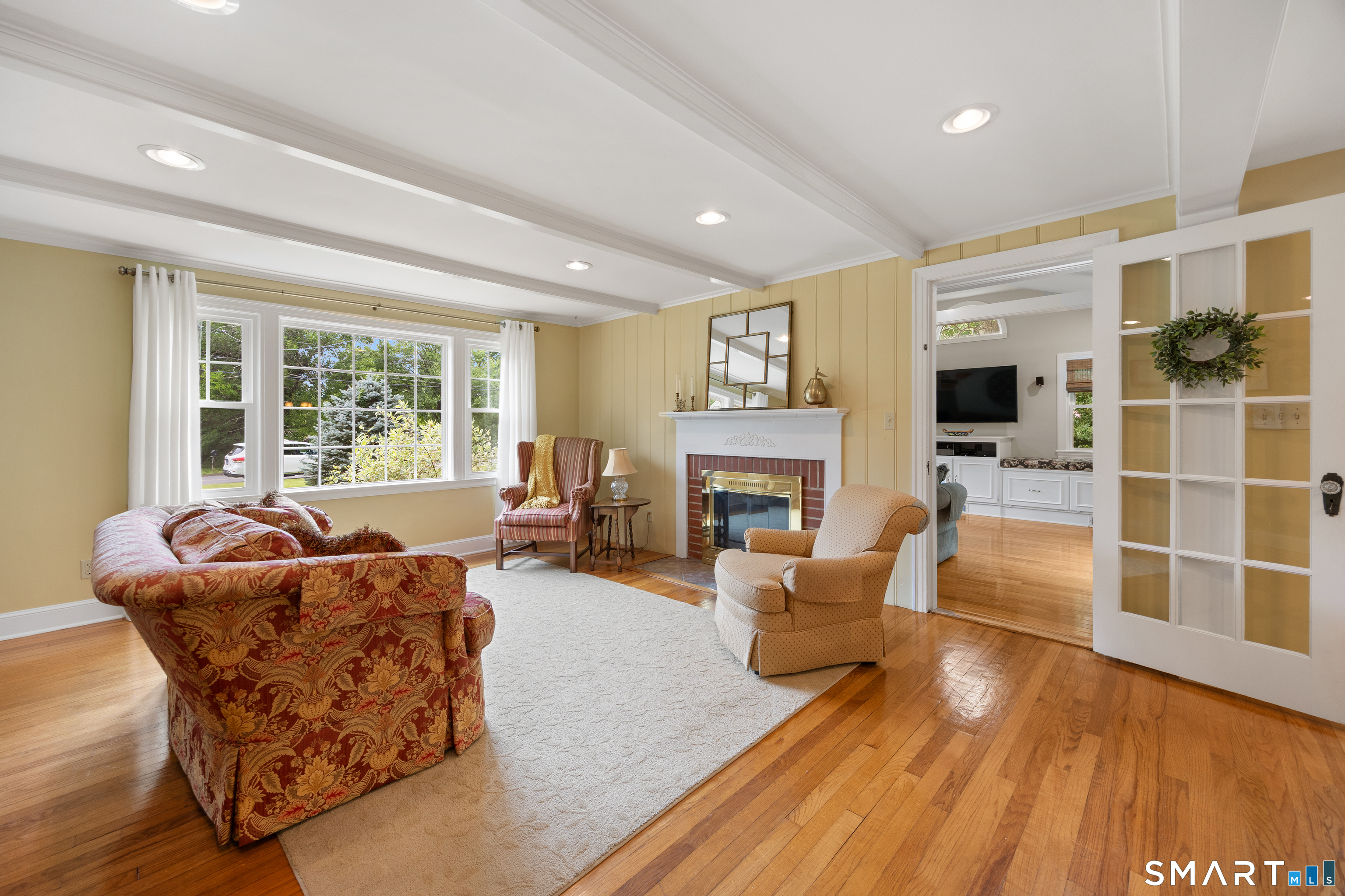 301 Wiese Road Cheshire, CT 06410 - Photo 5 of 40 another view of the living room shows the large bay window that invites natural light