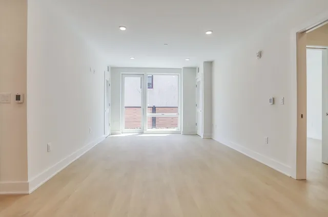a view of empty room with front door