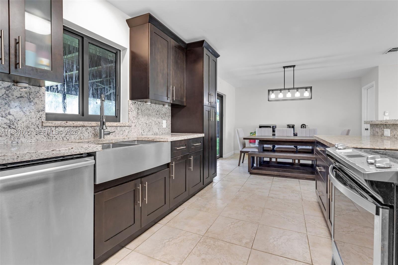 407 Northwest 18th Street Homestead, FL 33030 - Photo 11 of 44 UPDATED KITCHEN STAINLESS APPLIANCES