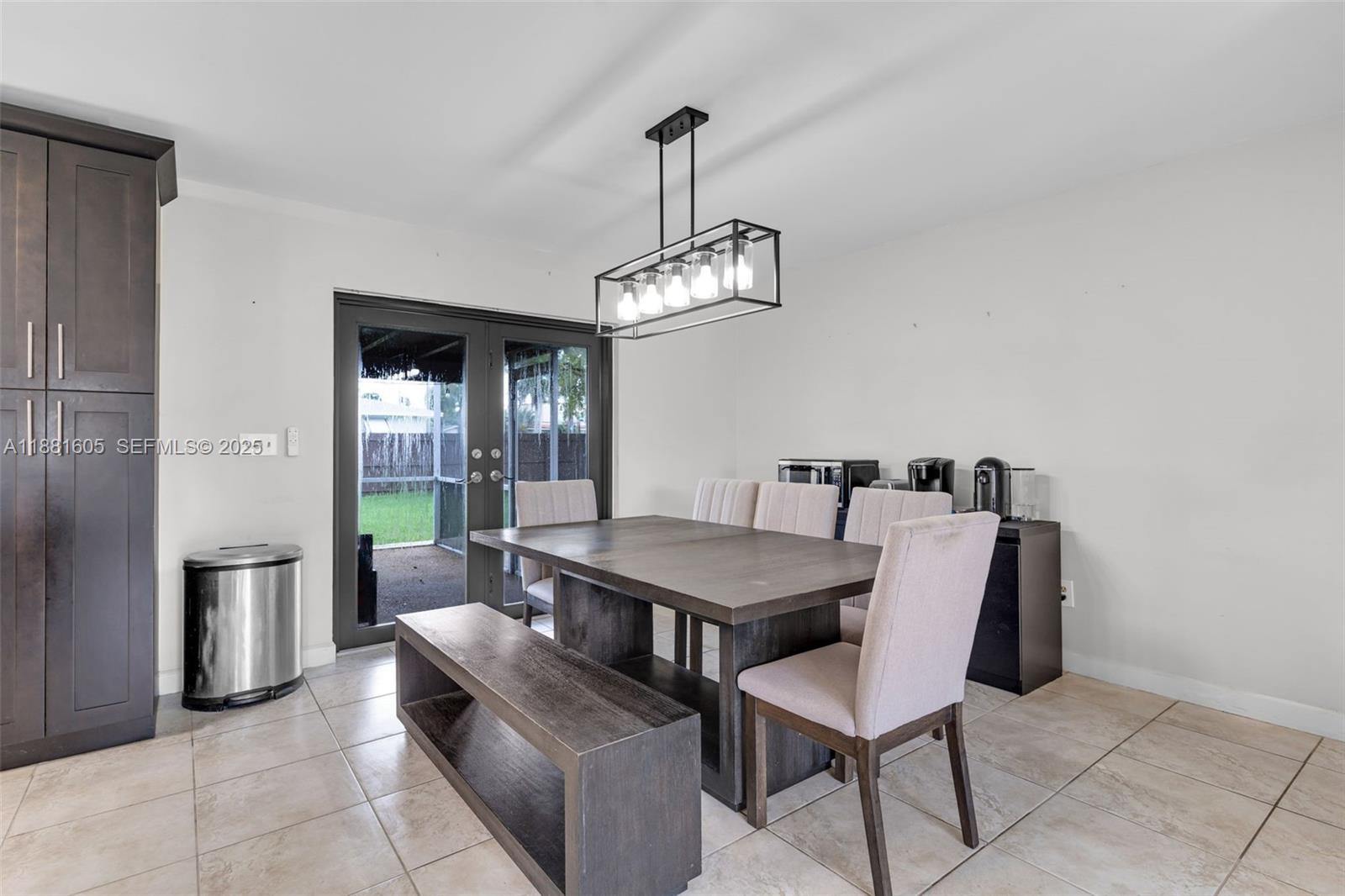 407 Northwest 18th Street Homestead, FL 33030 - Photo 18 of 44 USE AS FORMAL DINING OR EAT IN KITCHEN