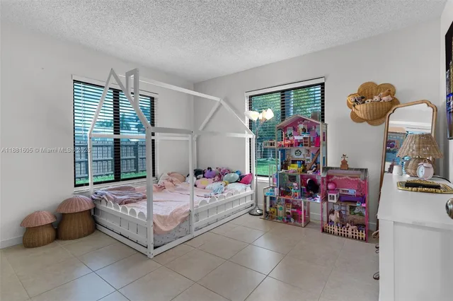 a kitchen with kitchen island and a stove