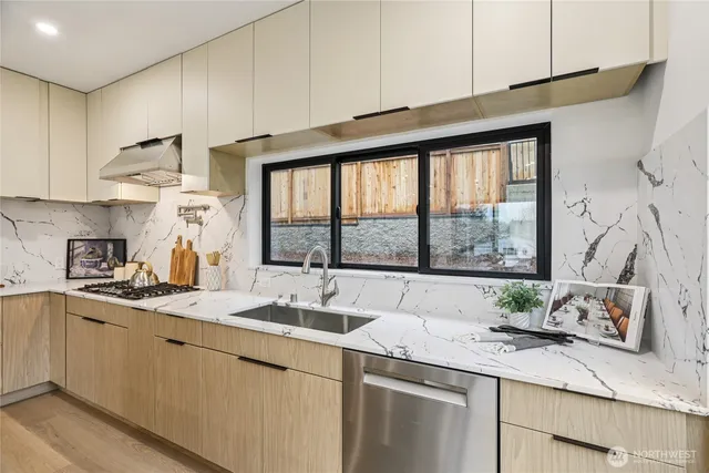 a kitchen with a sink stove and cabinets
