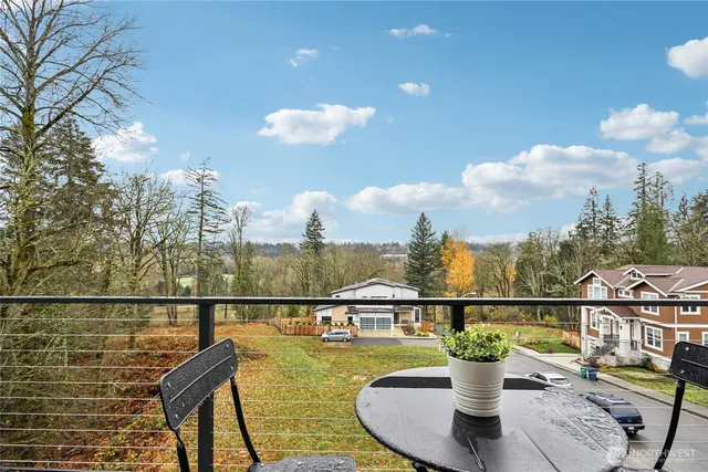 a view of a balcony with two chairs