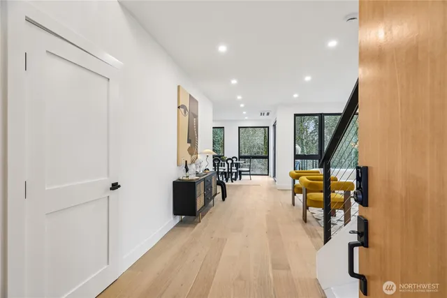 a lobby with furniture and floor to ceiling window