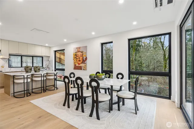 a view of a a dining room with furniture window and outside view