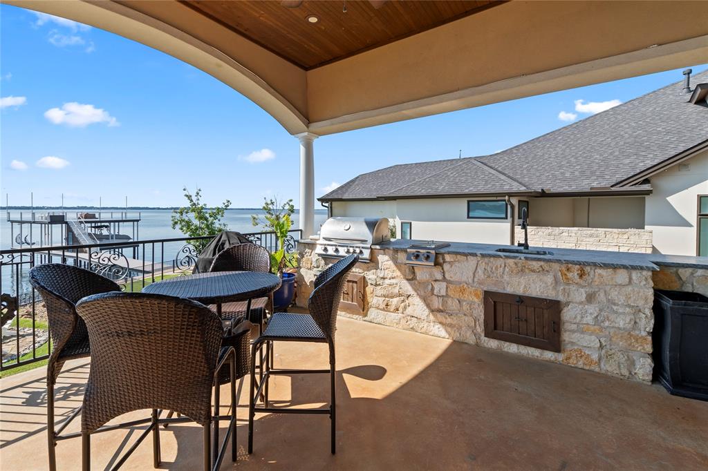 204 Pinnacle Club Place Mabank, TX 75156 - Photo 35 of 40 Outdoor kitchen with built-in griddle and sink for lakeside entertaining.