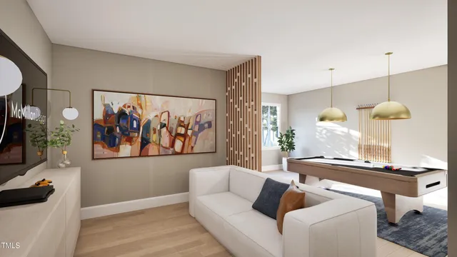 a living room with furniture and a painting on the wall