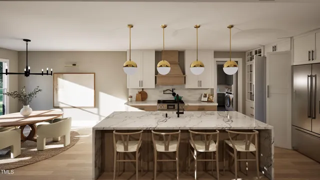 a kitchen with stainless steel appliances a table chairs and a chandelier