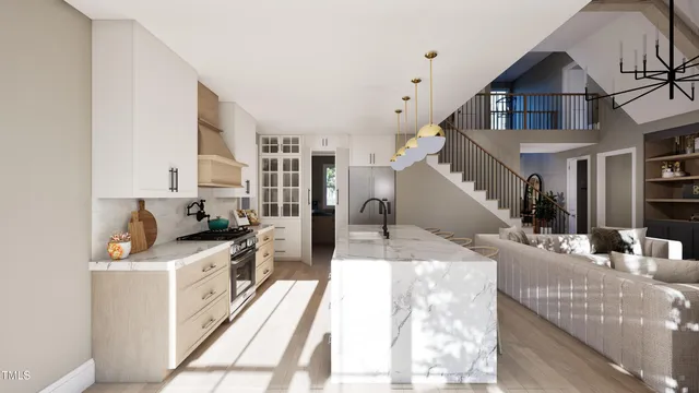 a view of a kitchen with furniture and wooden floor