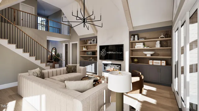 a living room with furniture a flat screen tv and kitchen view