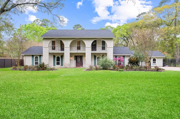 a kitchen with a stove sink and cabinets