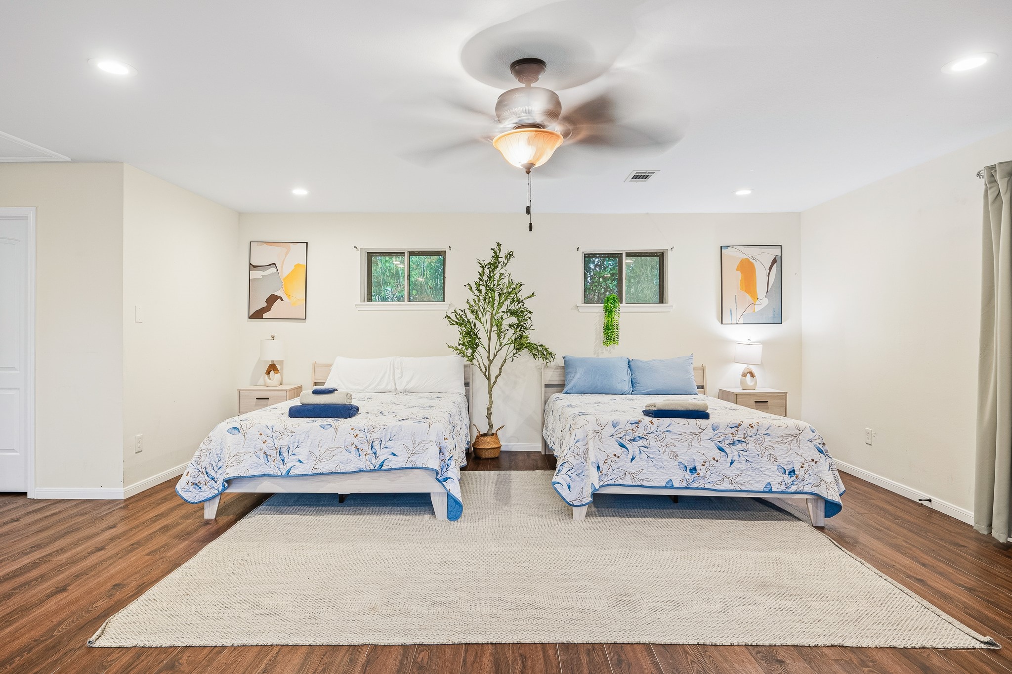 16811 Waycreek Road Houston, TX 77068 - Photo 37 of 50 a bedroom with two beds and a chandelier