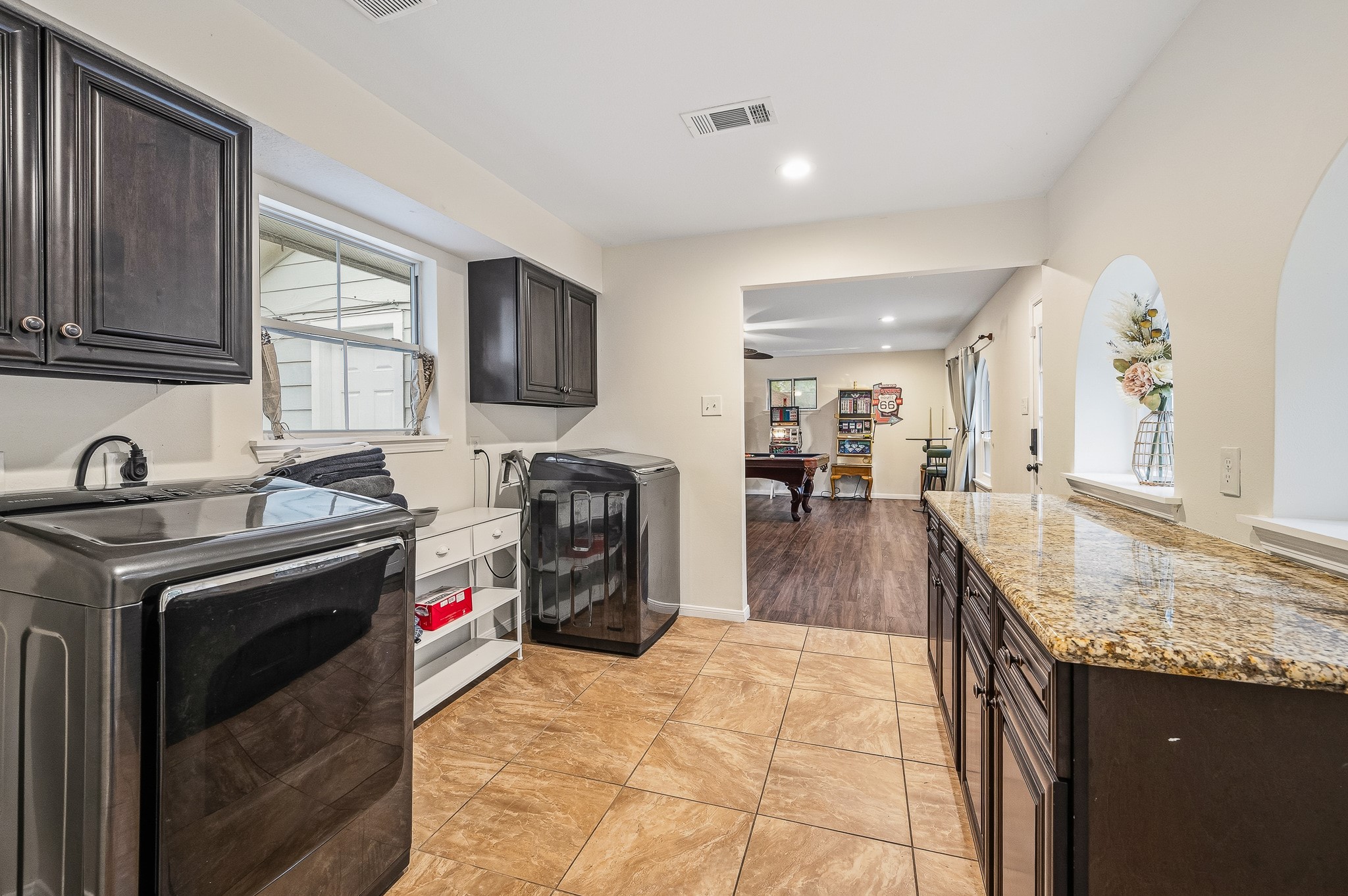 16811 Waycreek Road Houston, TX 77068 - Photo 44 of 50 a kitchen with stainless steel appliances granite countertop a sink stove and refrigerator