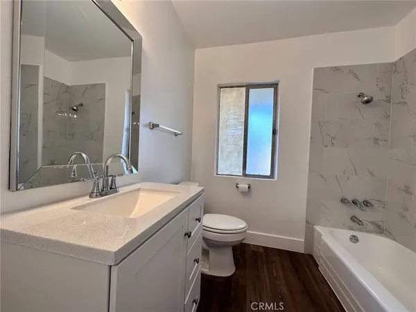 a bathroom with a sink a toilet and a bathtub