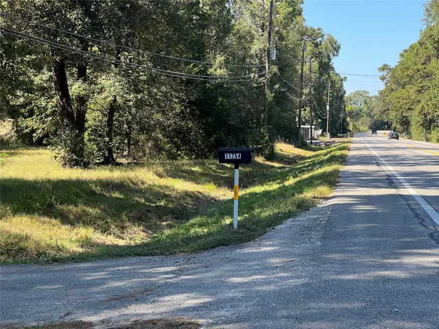 a view of a yard with swimming pool