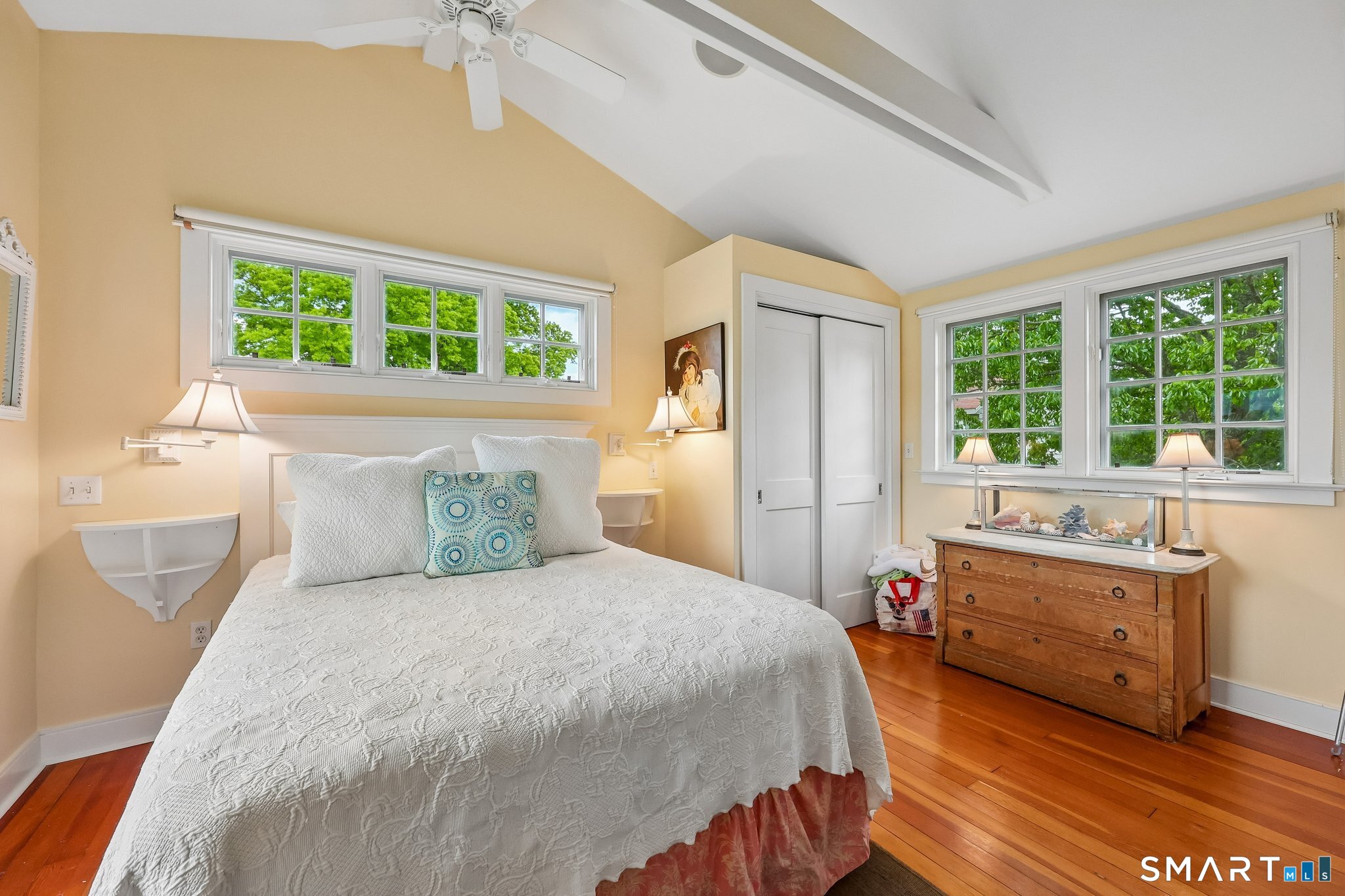 153 Middle Beach Road Madison, CT 06443 - Photo 31 of 40 The bedroom has an airy feeling with vaulted ceilings and views