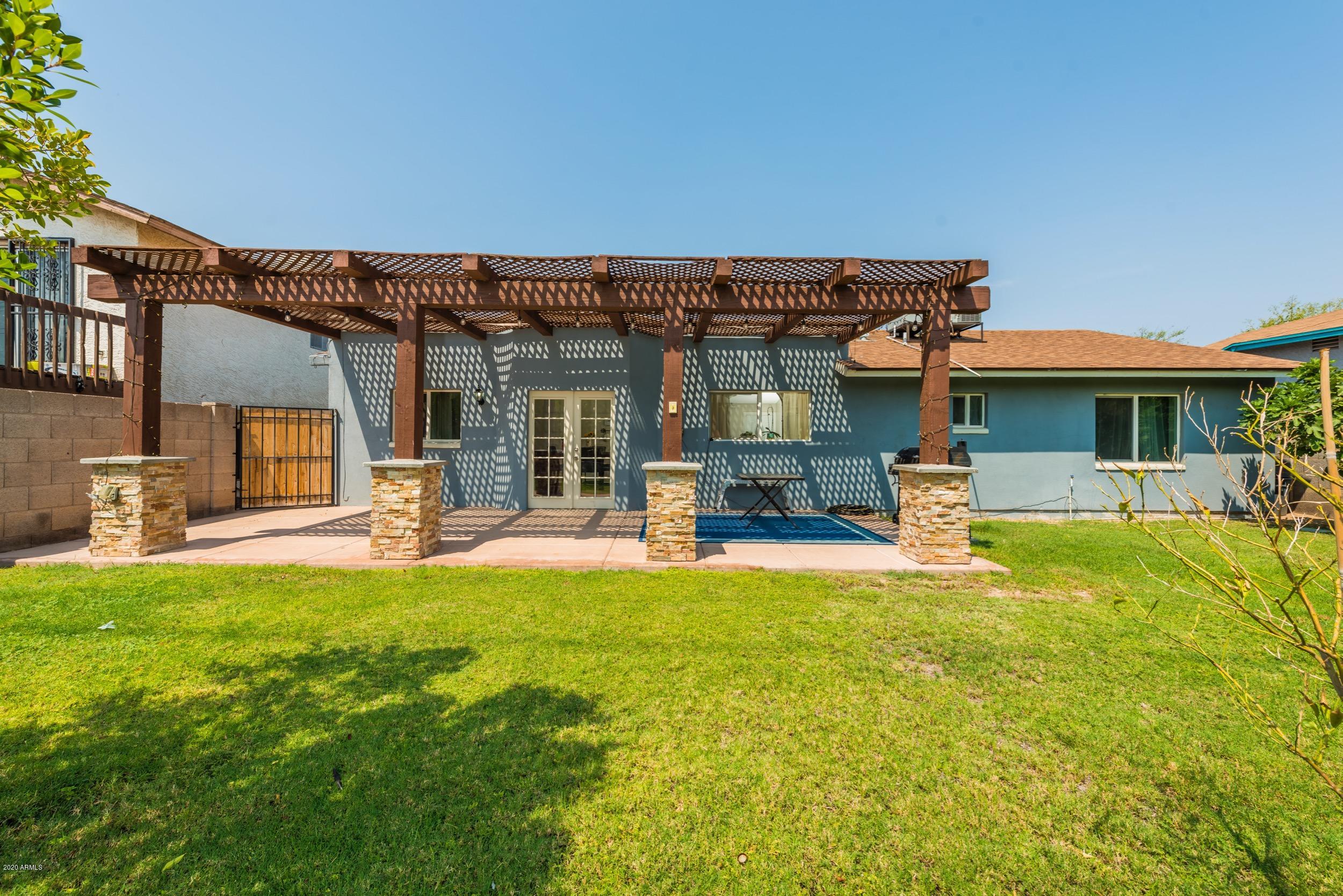 1407 East Fremont Road Phoenix, AZ 85042 - Photo 16 of 27 a view of a house with swimming pool and sitting area