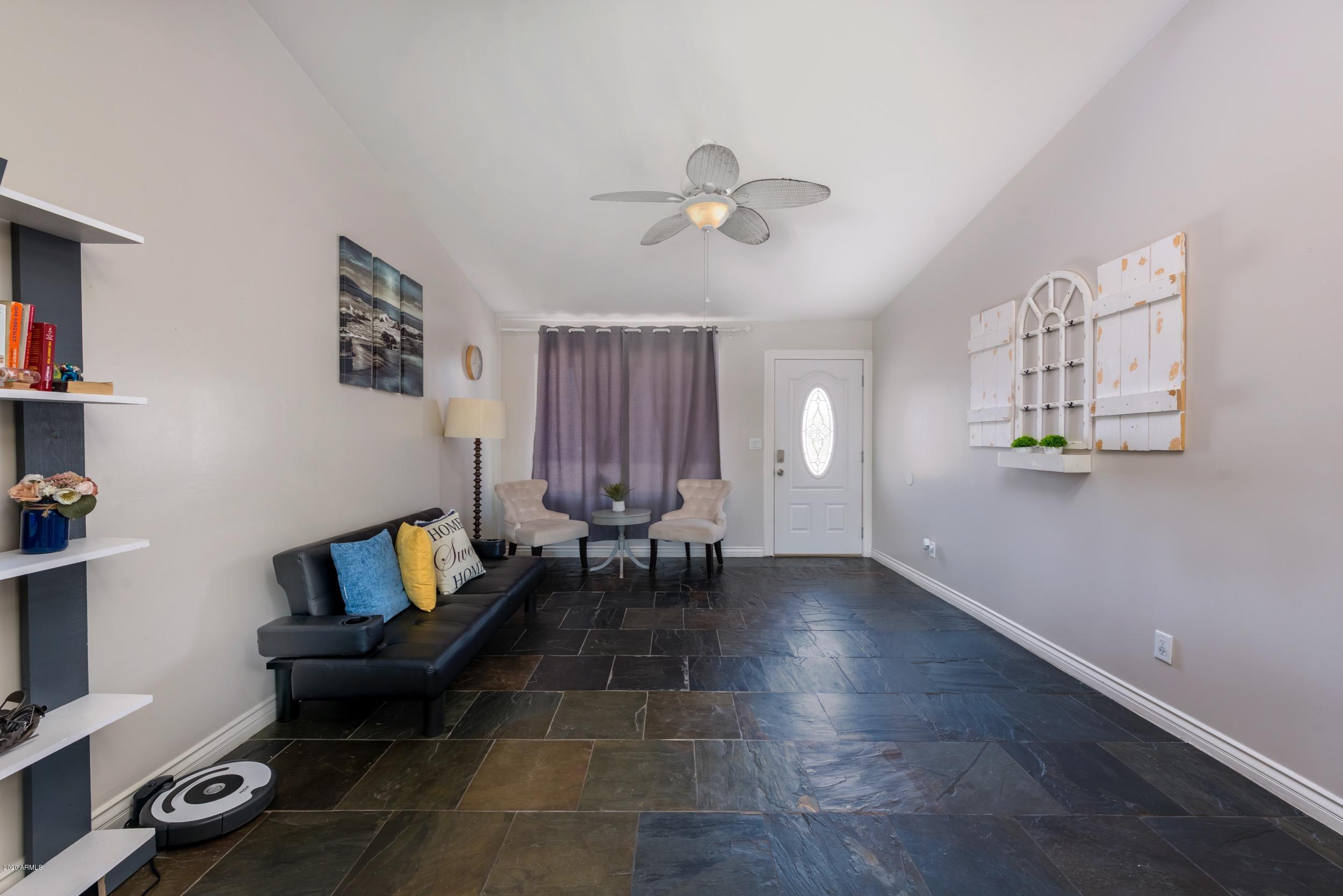 1407 East Fremont Road Phoenix, AZ 85042 - Photo 7 of 27 a living room with furniture and a flat screen tv