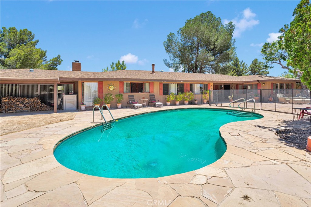 19955 Chickasaw Road Apple Valley, CA 92307 - Photo 46 of 60 a view of a house with a swimming pool