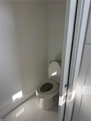 a bathroom with a toilet and a sink