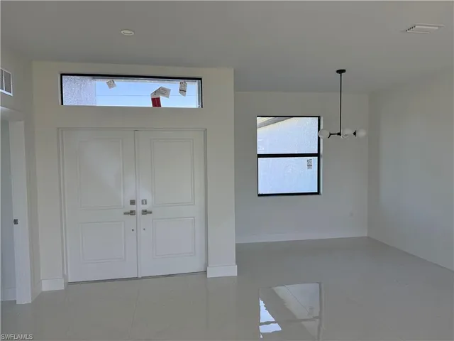 a view of an empty room with closet