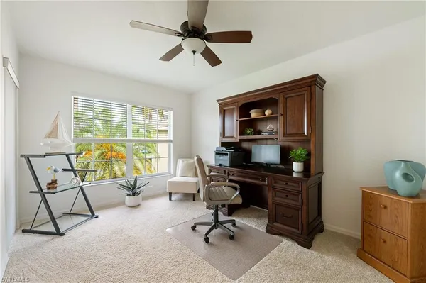 a work room with furniture and windows
