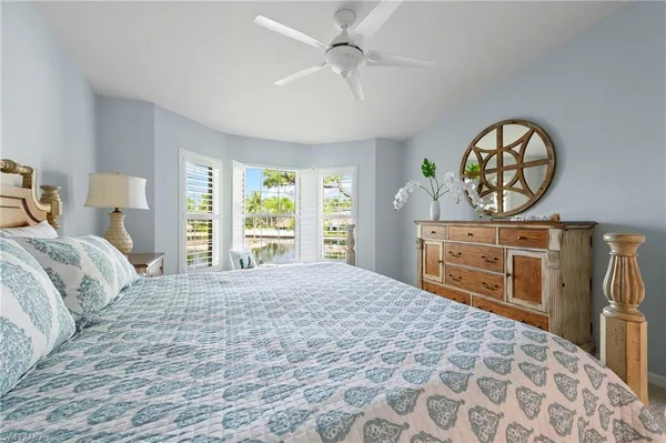 a bedroom with a bed and a cabinets