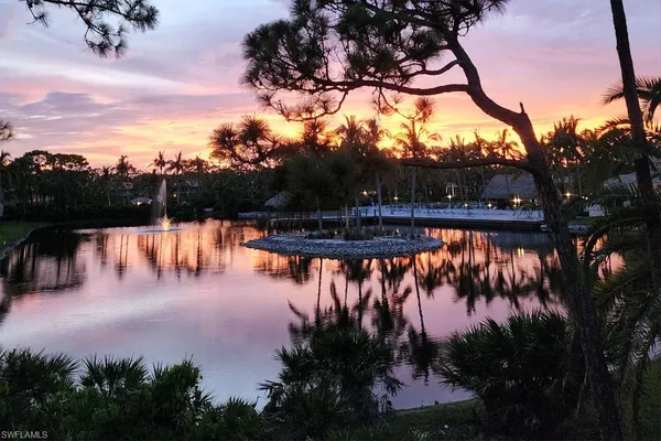 a view of a lake with a yard