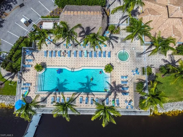 a swimming pool view with a outdoor seating space