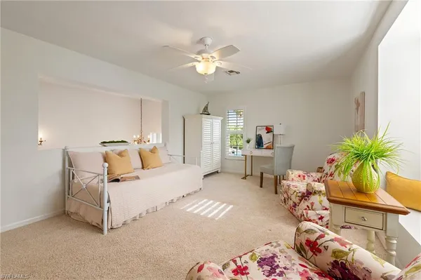 a bed room with a bed and a chandelier