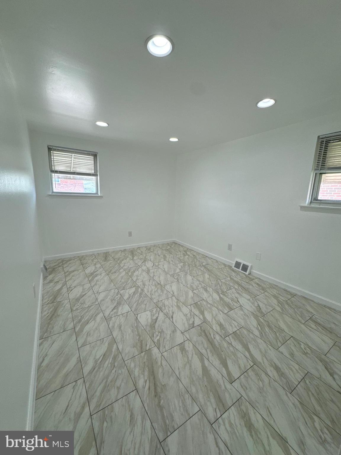 2327 Hoffnagle Street, Unit 2 Philadelphia, PA 19152 - Photo 9 of 19 an empty room with a workbench