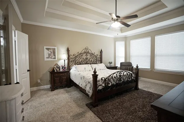 a large bathroom with a double vanity sink mirror and bathtub