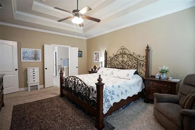 a bathroom with a tub sink shower and mirror