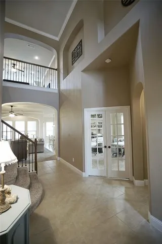 an entryway and livingroom with furniture