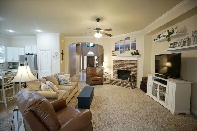 a kitchen with stainless steel appliances kitchen island granite countertop a sink and cabinets