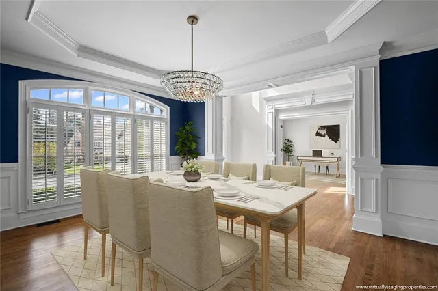 a view of an empty room with wooden floor fireplace and a window