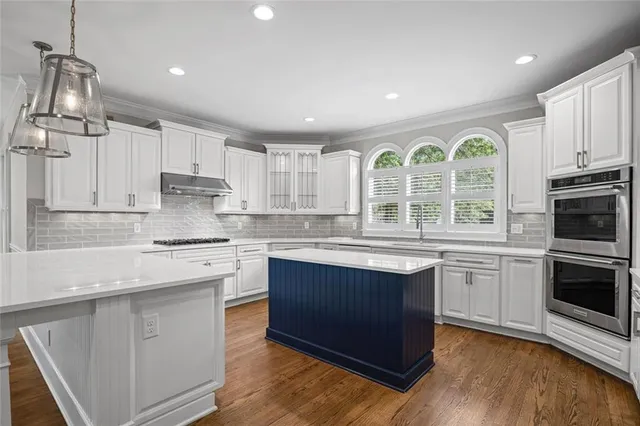 a bathroom with a sink toilet and bathtub