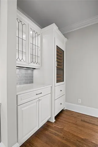 a bathroom with double vanity sinks a vanity a vanity and a mirror