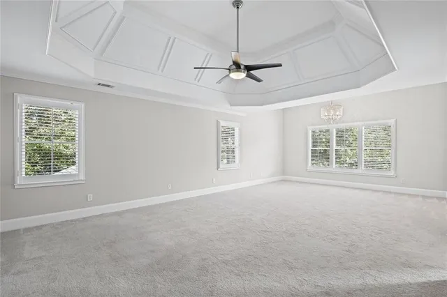 a kitchen with stainless steel appliances granite countertop a sink window and cabinets